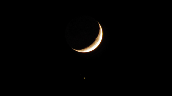 The Crescent Moon and Jupiter just below.